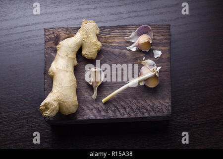top view ginger and garlic on a wooden board Stock Photo