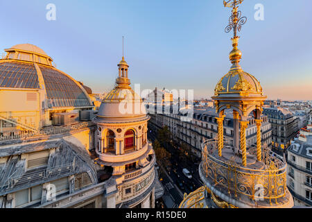 PARIS, 25 October 2018 - Sunset on the Paris' roofs and the Paris Opera Garnier building in the Haussmann district, France Stock Photo