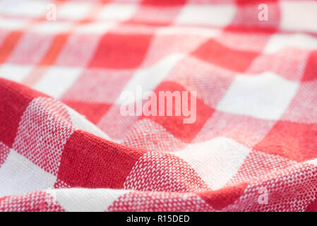 red and white checkered creased  kitchen towel background texture Stock Photo