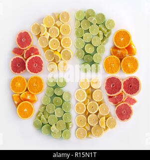 Many fruits in the shape of a sliced citrus including oranges, grapefruits, lemons and limes Stock Photo