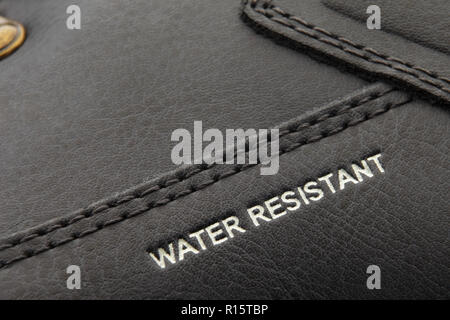 leather boots stitched with thread macro Stock Photo