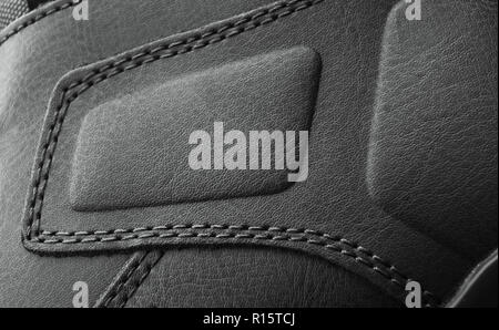 leather boots stitched with thread macro Stock Photo