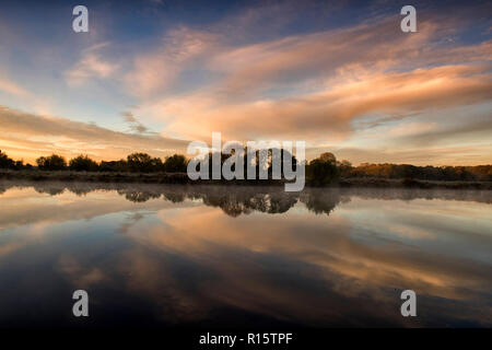 Sunrise reflections on the River Trent at Colwick Country Park in Nottingham, Nottinghamshire England UK Stock Photo