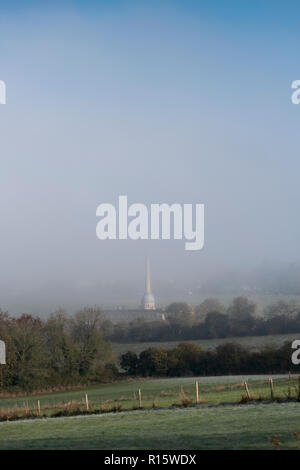 Early morning fog over Bliss Tweed Mill in autumn. Chipping Norton, Cotswolds, Oxfordshire, England Stock Photo