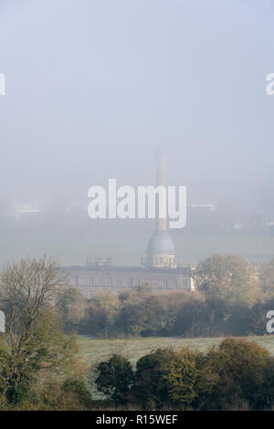 Early morning fog over Bliss Tweed Mill in autumn. Chipping Norton, Cotswolds, Oxfordshire, England Stock Photo