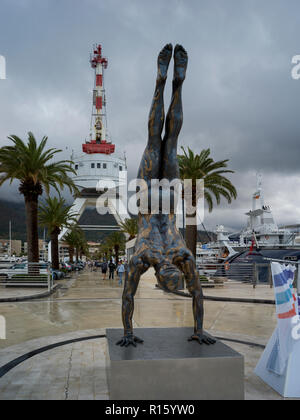 Statue of a man doing handstand, Porto Montenegro, Bay of Kotor, Montenegro Stock Photo