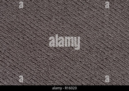 Strict grey textile background with relief surface. Stock Photo