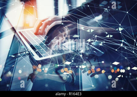 Business man works in office with laptop. Concept of internet network. double exposure Stock Photo