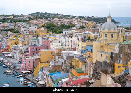 Marina Corricella, colourful fishing village on the island of Procida in the Bay of Naples, Italy. Photo taken from the top of the cliff. Stock Photo