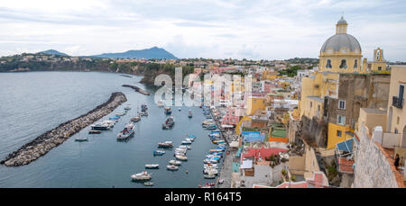 Marina Corricella, colourful fishing village on the island of Procida in the Bay of Naples, Italy. Photo taken from the top of the cliff. Stock Photo