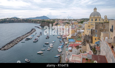 Marina Corricella, colourful fishing village on the island of Procida in the Bay of Naples, Italy. Photo taken from the top of the cliff. Stock Photo