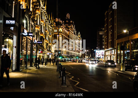 View of the Harrods Department Store on Brompton Road in Knightsbridge, London at night. Stock Photo