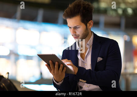 Young manager using a digital tablet outdoor Stock Photo