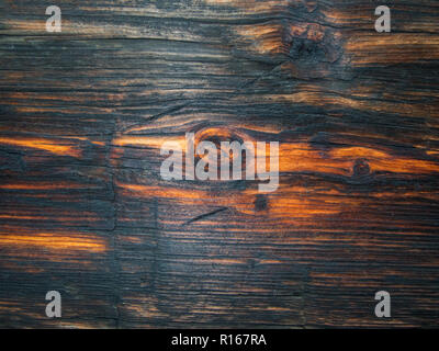 Knot hole on a a beautiful wood plank makes a pretty background and texture. Stock Photo