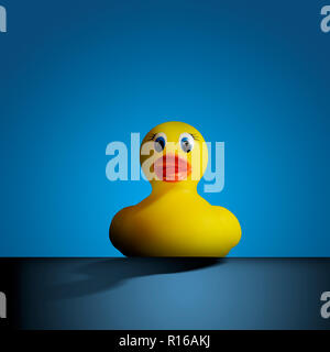 Yellow rubber duck against blue background, front view Stock Photo