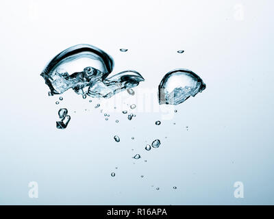 Contorting air bubbles in clear transparent liquid, detail Stock Photo