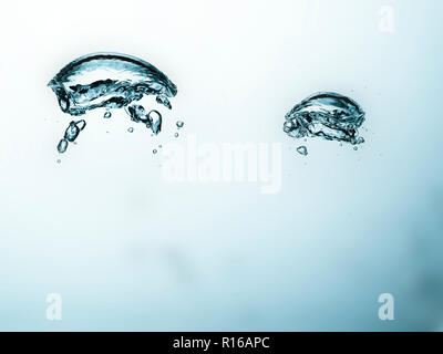 Contorting air bubbles in clear transparent liquid, detail Stock Photo