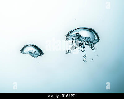 Contorting air bubbles in clear transparent liquid, detail Stock Photo