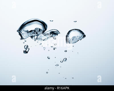 Contorting air bubbles in clear transparent liquid, detail Stock Photo