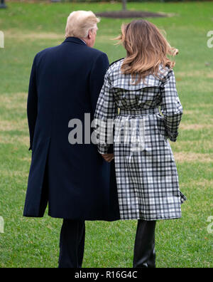 United States President Donald J. Trump and First lady Melania Trump walk on the South Lawn of the White House in Washington, DC on Friday, November 9, 2018 en route to Paris, France where they will participate in the ceremonies commemorating the 100th anniversary of the end of World War I. Credit: Ron Sachs/CNP | usage worldwide Stock Photo