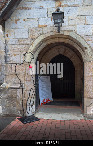 Penshurst, UK. 9th November 2018. There but not there, an installation of 50 silhouettes of fallen soldiers from the first world war at St John the Baptist, Penshurst, Kent. Designed by Martin Barraud and an initiative which originated in THIS church but now spread nationwide This is the  2018 installation to mark the centenary of Armistice commemoration  to mark the fallen Tommy soldiers Credit: Sarah Mott/Alamy Live News Stock Photo