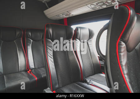 Seats in the cabin of a modern minibus. Stock Photo