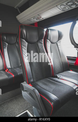 Seats in the cabin of a modern minibus. Stock Photo