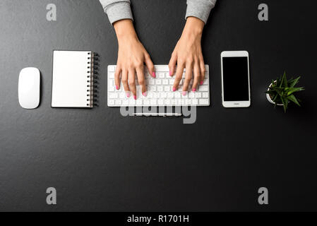 Overhead shot of woman working in office. Copy space Stock Photo