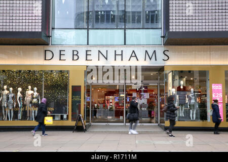 Shoppers are seen outside Debenhams store on London's Oxford Street.  Debenhams plans to close up to 50 stores, nearly a third of the UK-wide chain, putting up to 5,000 jobs at risk. The department store unveiled a near £500m annual loss as it writes off the value of its brand and the cost of unwanted shop leases and IT systems. The retail sector faces difficulties as consumers cut down on spending and do more of their shopping online. A report by accountancy firm PWC has said that over 1,000 stores disappeared from Britain's top 500 high streets in the first six months of the year. Stock Photo