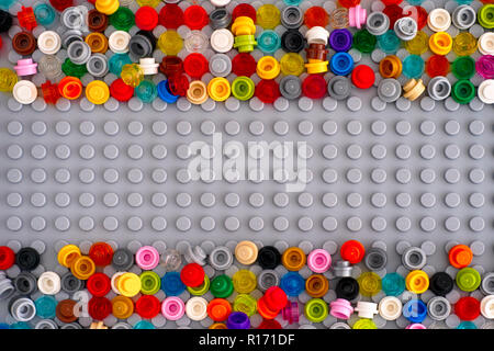 Tambov, Russian Federation - September 02, 2018 Lego gray baseplate with many scattered Round Bricks 1x1. Studio shot. Stock Photo