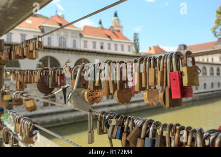 LJUBLJANA, SLOVENIA - JUNE 28, 2015: Love padlocks on a bridge in Ljubljana Stock Photo