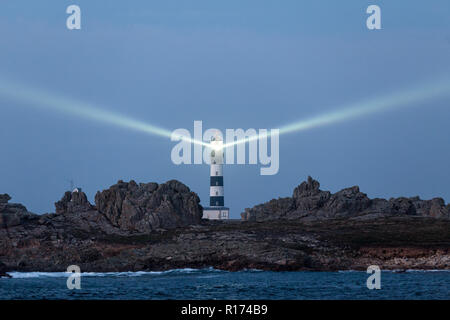 The most powerful lighthouse in the world, illuminated at dusk, Creach point, Brittany, France Stock Photo