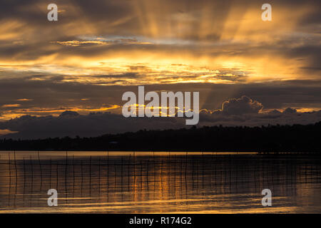 Dramatic tropical sunset in the Samal island, Philippines Stock Photo