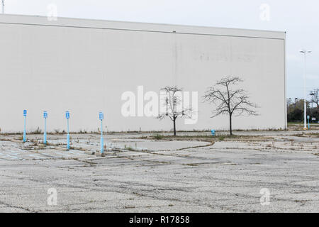 The faded outline of a logo sign outside of a closed Sears retail store in Waterford Township, Michigan on October 26, 2018. Stock Photo