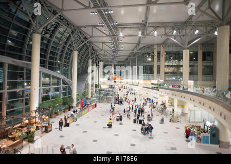 Moscow, Domodedovo, Russia - July 8, 2018: Hall of Domodedovo International Airport in Moscow with Passengers Inside. Night Time. Orange Airplane Stock Photo