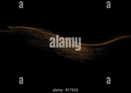 Sandy wave isolated on black background. Abstract sand dune. Stock Photo