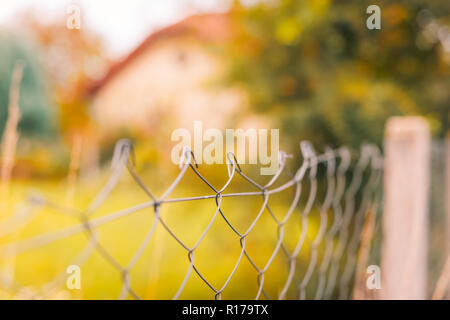 An old rusty fence of a country house Stock Photo