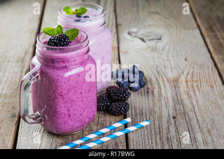 Selection of colorful detox berry drinks on wood background Stock Photo