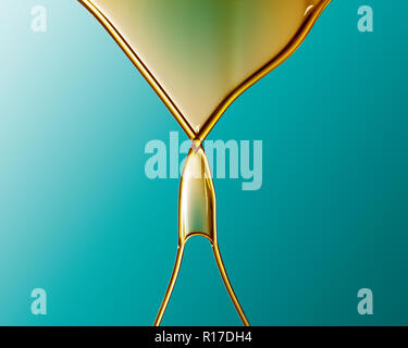 Golden coloured oil flowing into V shape and crossing over against blue background Stock Photo