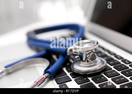 Stethoscope on laptop keyboard. Health care or IT security concept Stock Photo