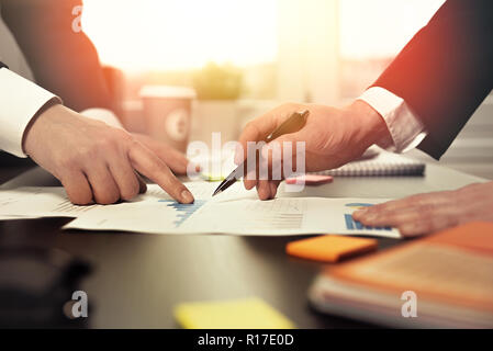 Two businessmen at work in office, Working day, business process on desk, financial manager at work Stock Photo