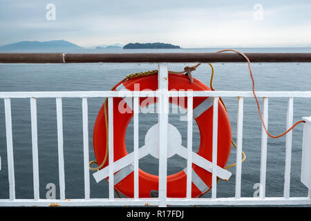 A lifebuoy on a boat in the Seto inland sea, also known as Setouchi, Japan Stock Photo