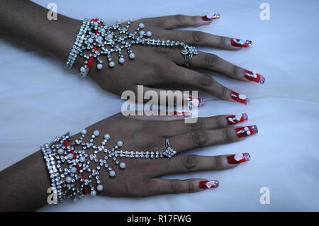 Hand jewelry being worn by a Cambodian bride during a traditional Khmer wedding. Phnom Penh, Cambodia. © Kraig Lieb Stock Photo