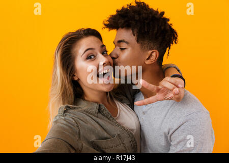 Photo Young Cute Loving Couple Sitting Outdoors While Make Selfie Stock  Photo by ©Vadymvdrobot 216728902