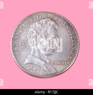 half dollar coin isolated on pink background Stock Photo