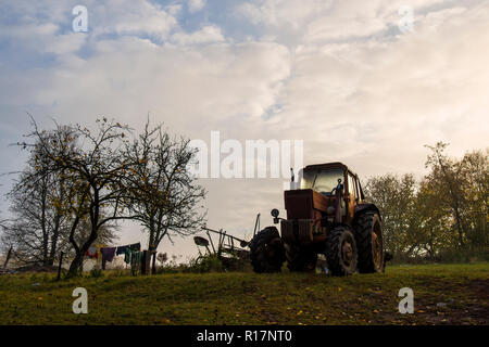laundry, farmer, agricultural tools, tractor, hay rake, autumn, falling leaves Stock Photo