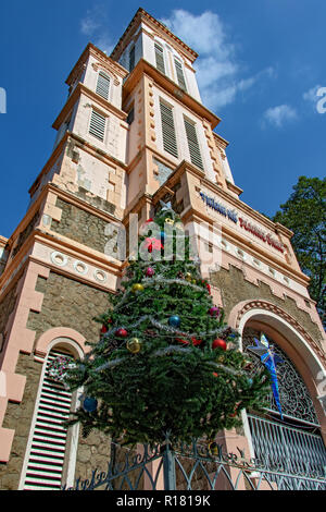SAIGON, VIETNAM, DEC 18 2017, The Church of St. Joan of Arc at Ho Chi Minh city with a Christmas tree as decoration for Xmas holidays. Stock Photo