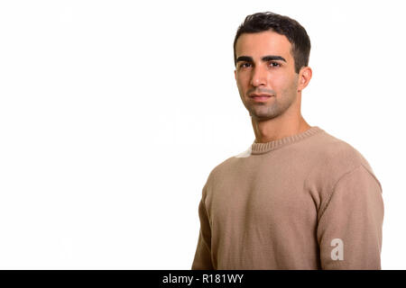 Portrait of young handsome Persian man against white background Stock Photo