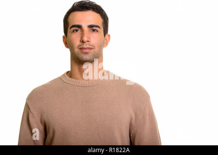 Portrait of young handsome Persian man against white background Stock Photo