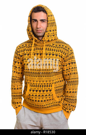 Portrait of young handsome Persian man wearing hoodie Stock Photo